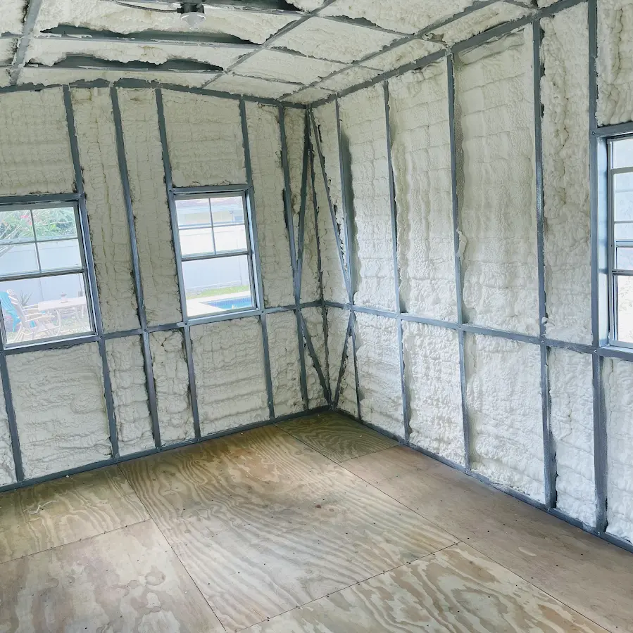 Closed-cell spray foam insulation applied to wall cavities in a residential project in Canby